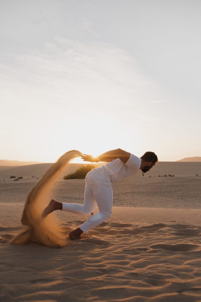 Man jumping on desert